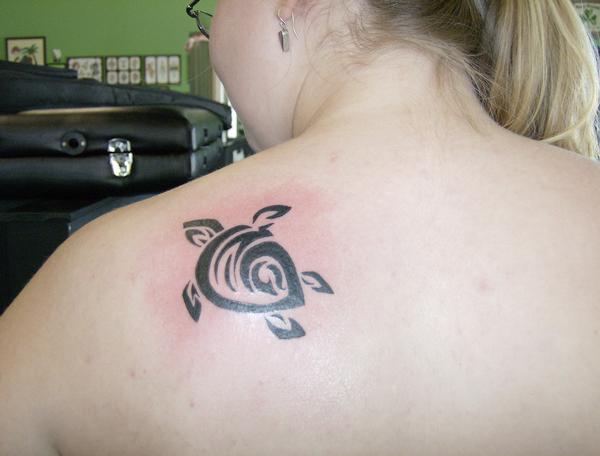 Small Tribal Peace Turtle Tattoo On Left Back Shoulder