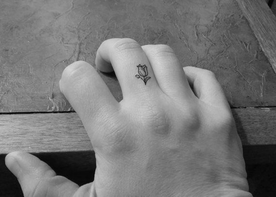 Small White Tulip Flower Tattoo On Finger