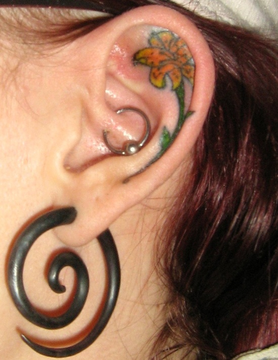 Small Yellow Lily Tattoo Inside Ear