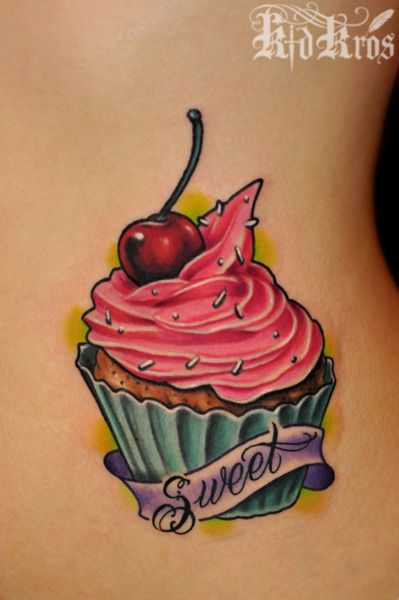Sweet Banner With Cupcake Tattoo On Lower Back