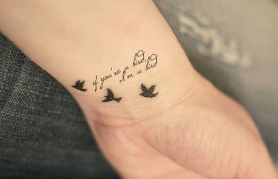 Tiny Black Dove Flying Tattoos On Wrist