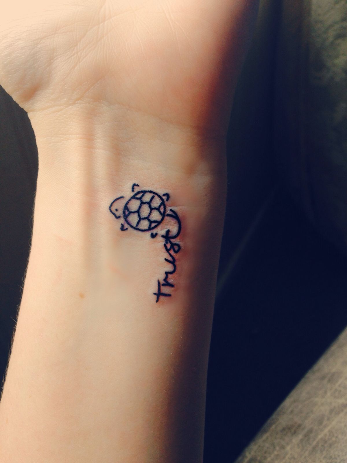 Tiny Peace Turtle Tattoo On Left Wrist