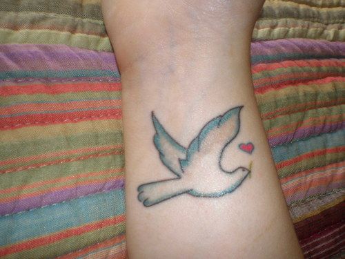 Tiny Red Heart And Blue Dove Tattoo On Wrist
