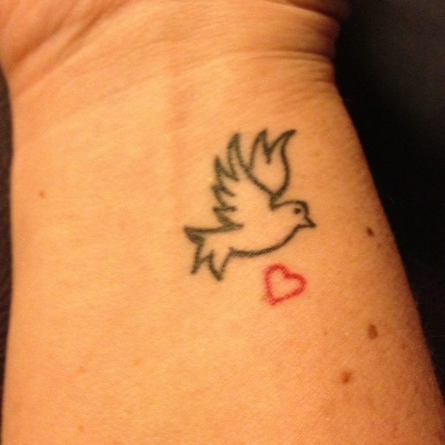 Tiny Red Heart And Peace Dove Tattoo On Right Wrist