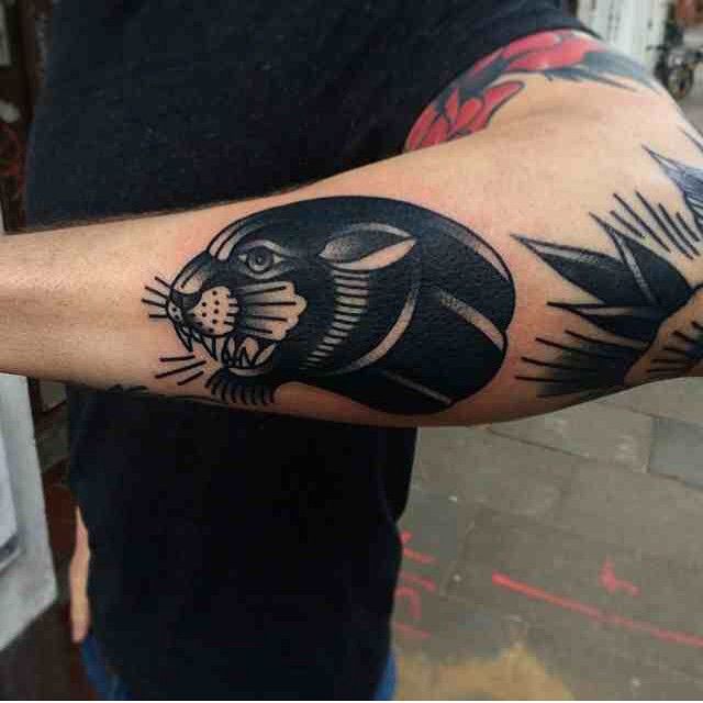 Traditional Black Panther Head Tattoo On Left Arm