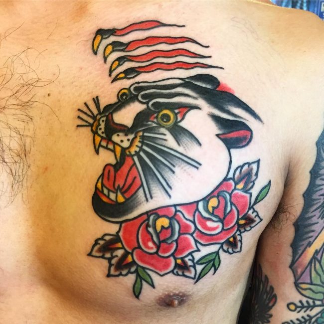 Traditional Roses And Panther Head Tattoo On Man Chest
