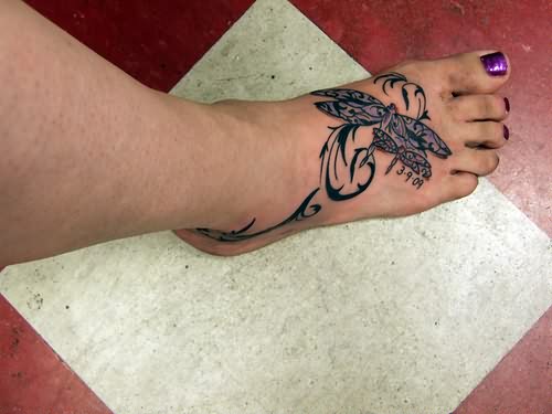 Tribal Dragonfly Tattoo On Girl Right Foot