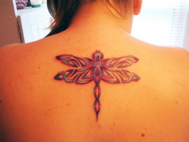 Tribal Dragonfly Tattoo On Girl Upper Back