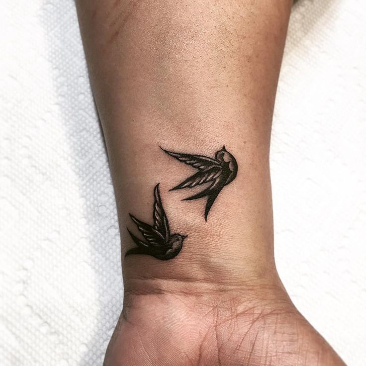 Two Flying Dove Tattoos On Wrist