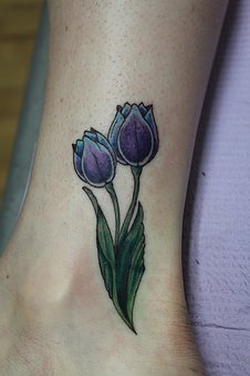 Two Tulip Flowers Tattoo On Side Ankle