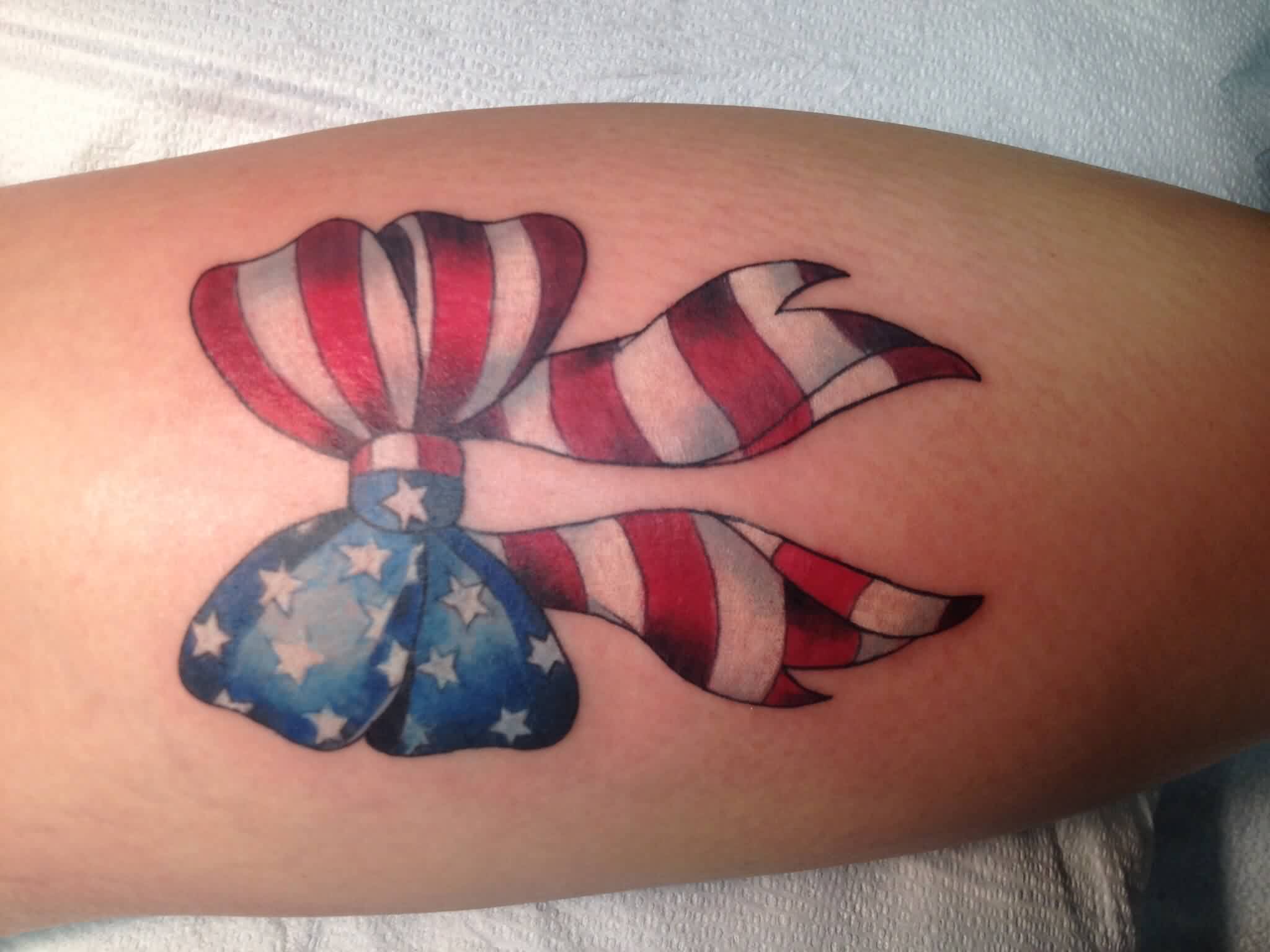 U.S Flag Bow Tattoo On Back Leg