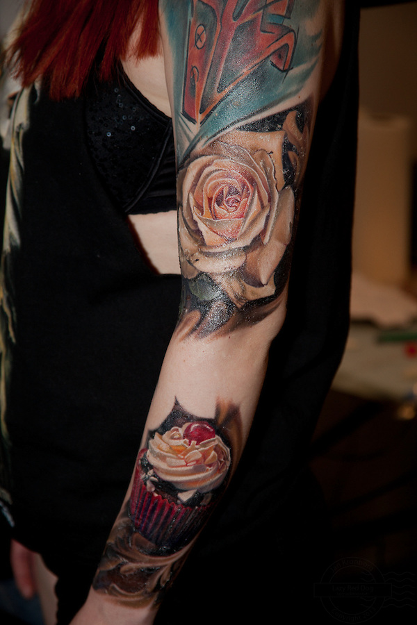White Rose Floower Realistic Cupcake Tattoo On Arm Sleeve