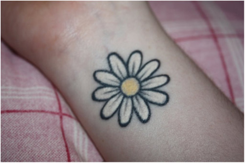 White Small Daisy Tattoo On Right Wrist
