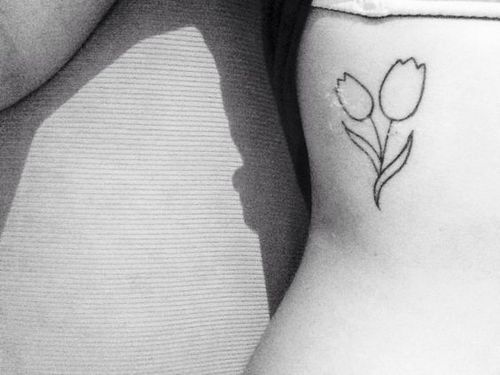 White Tulip Flower Outline Tattoo On Side Rib