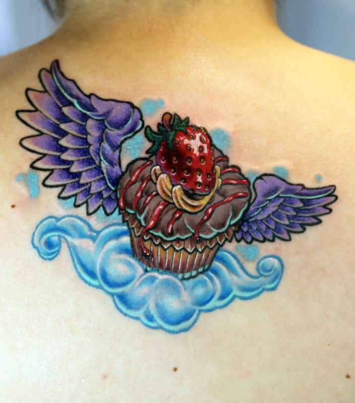 Winged Realistic Cupcake Tattoo On Upper Back