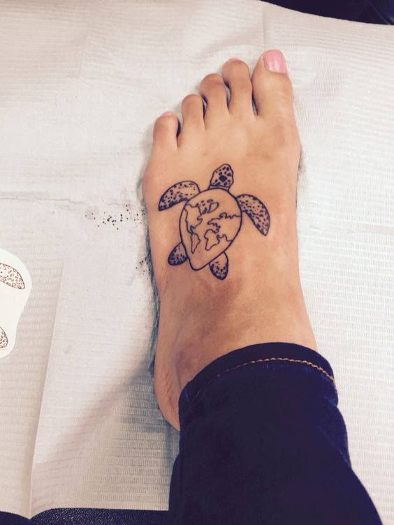 World Map In Turtle Tattoo On Girl Left Foot