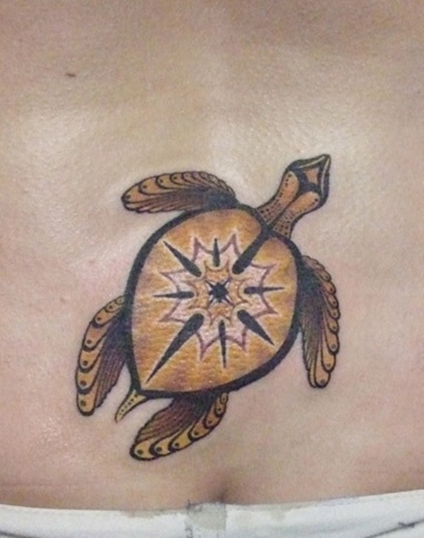 Yellow And Brown Ink Turtle Tattoo On Lower Back