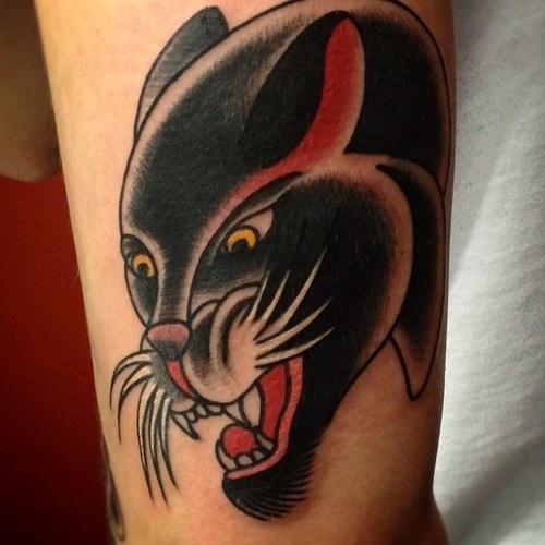 Yellow Eyes Angry Panther Head Tattoo On Bicep