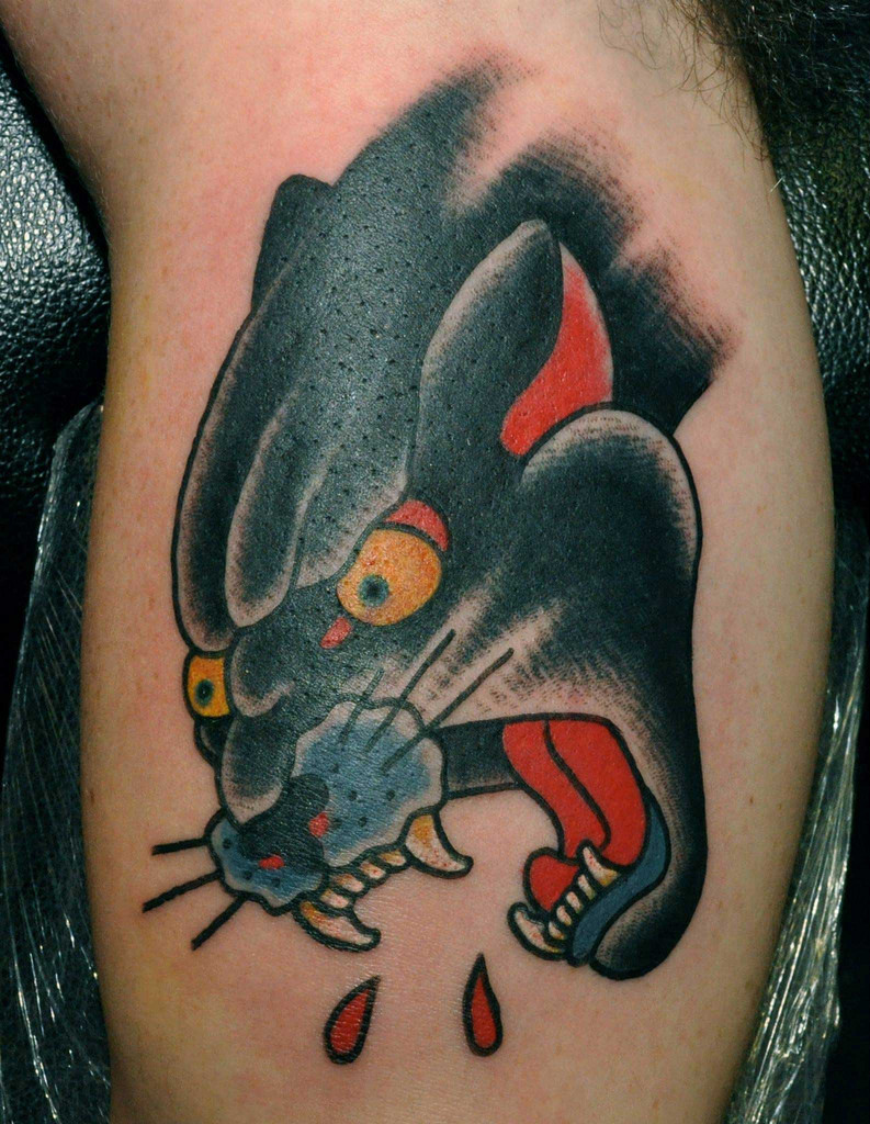 Yellow Eyes Angry Traditional Panther Tattoo On Bicep