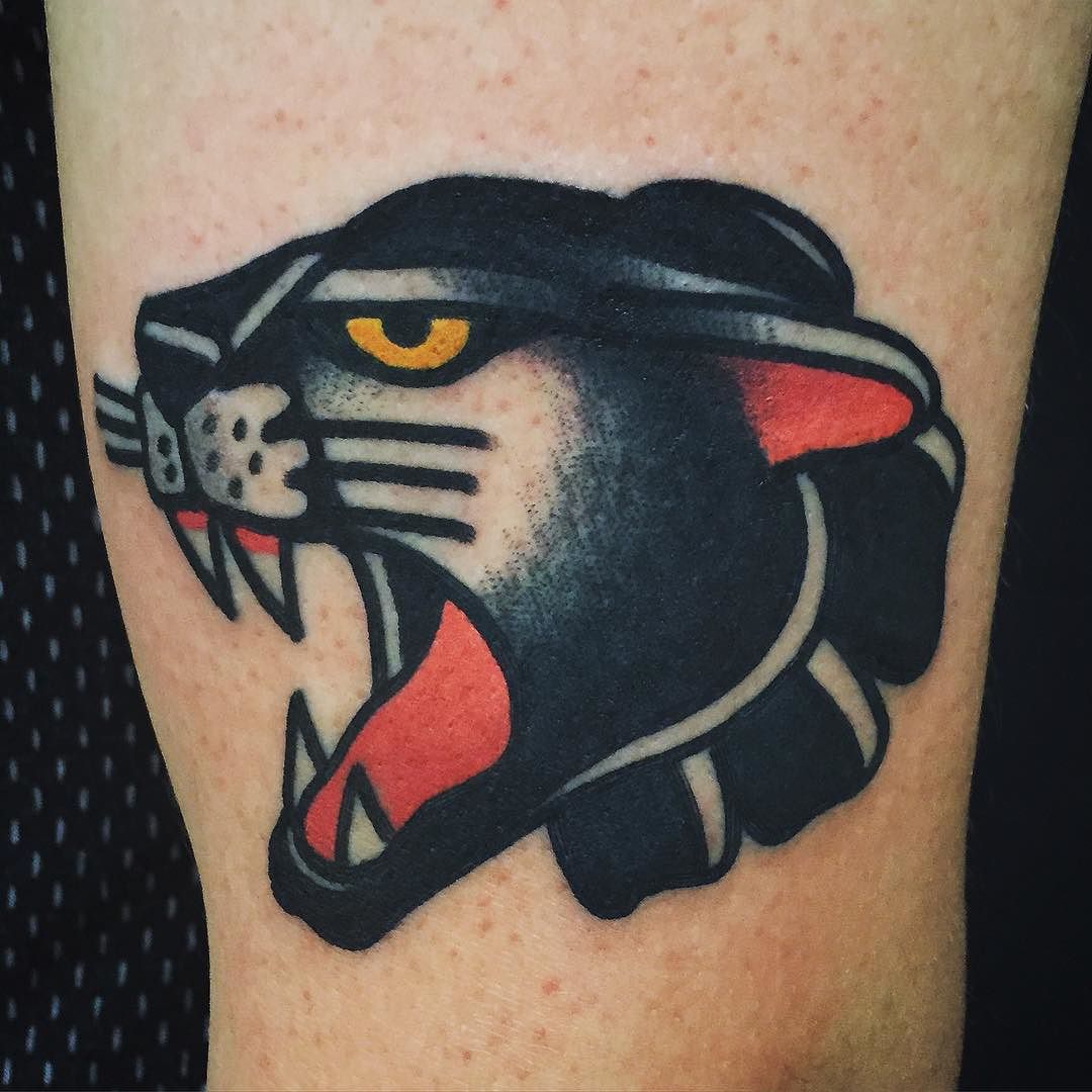 Yellow Eyes Traditional Panther Tattoo On Bicep