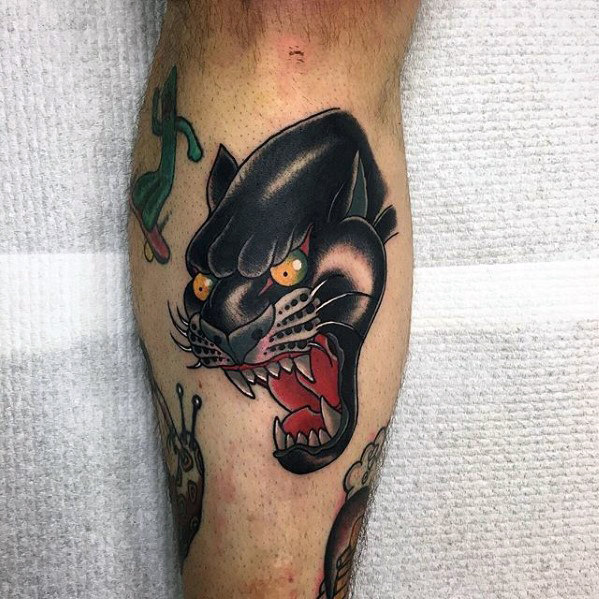 Yellow Eyes Traditional Panther Tattoo On Leg