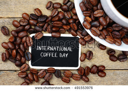 International Coffee Day Text Written On Black Board With Coffee Beans