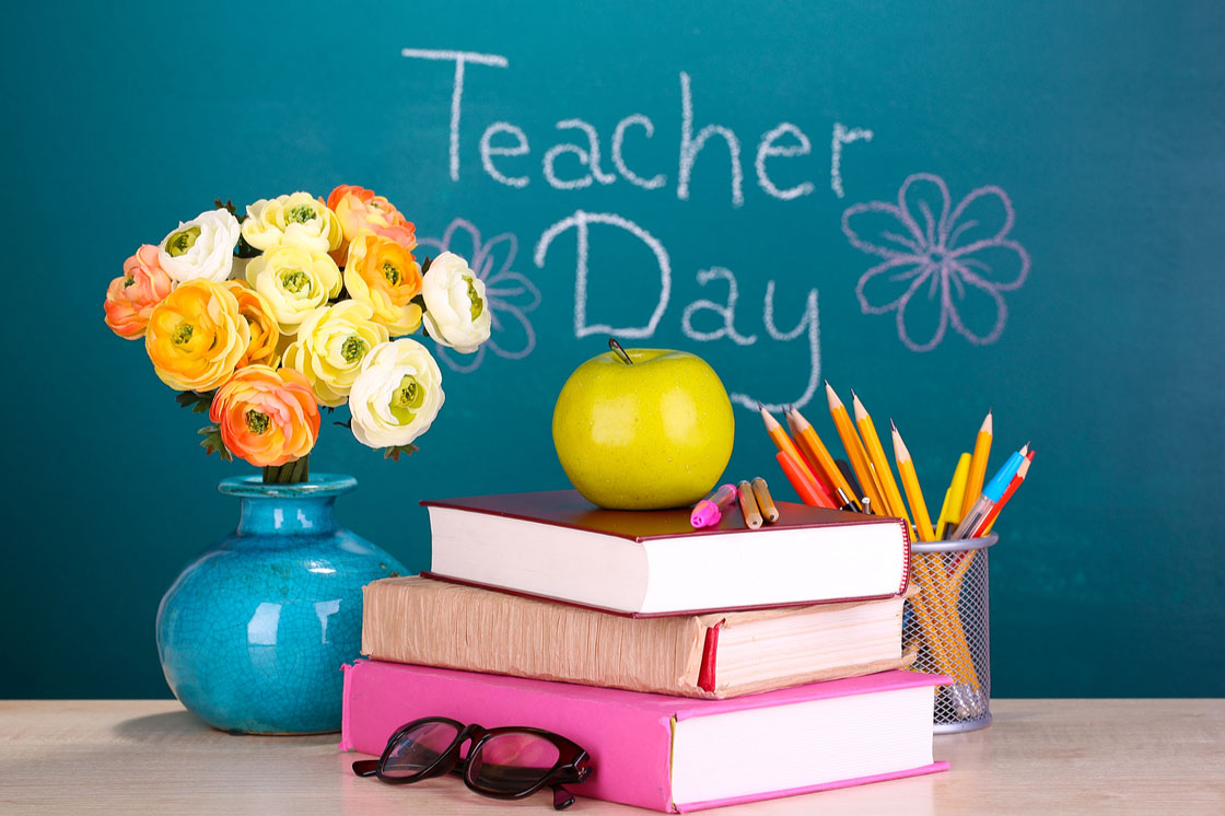 World Teachers Day Books With Flowers And Apple Picture