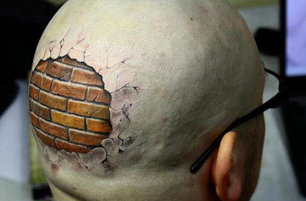 3d Bricks tattoo on man’s bald head