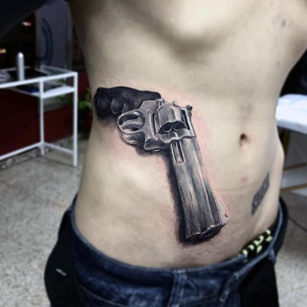 3d Pistol Tattoo On Lower Rib Cage For men
