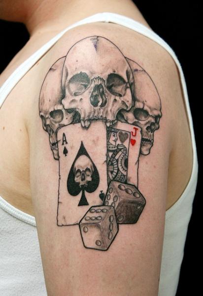 Ace Of Spade In Skull Mouth With Dice Tattoo On Left Shoulder