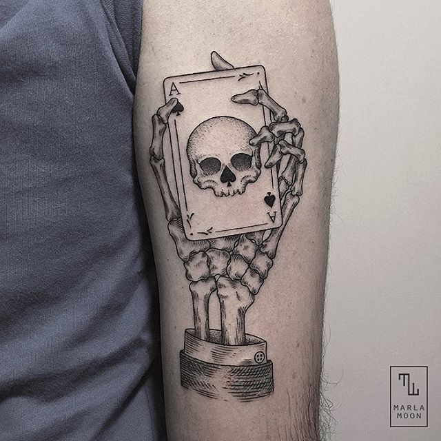 Ace Of Spade With Skull Card Holding With Skeleton Hand Tattoo On Arm