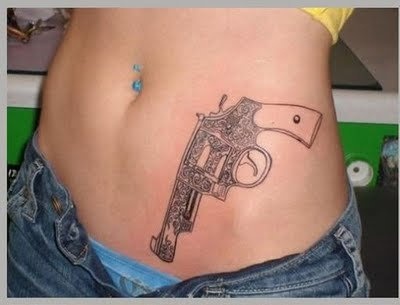 Adorable Pistol Tattoo On stomach For Girls