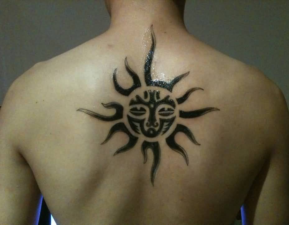 Amazing Black Ink Sun Tattoo On Mans Back