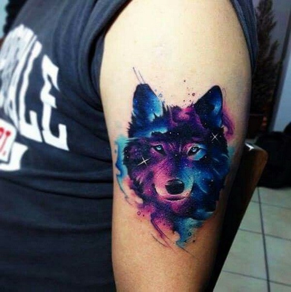 Amazing Watercolor Wolf face Tattoo On Bicep