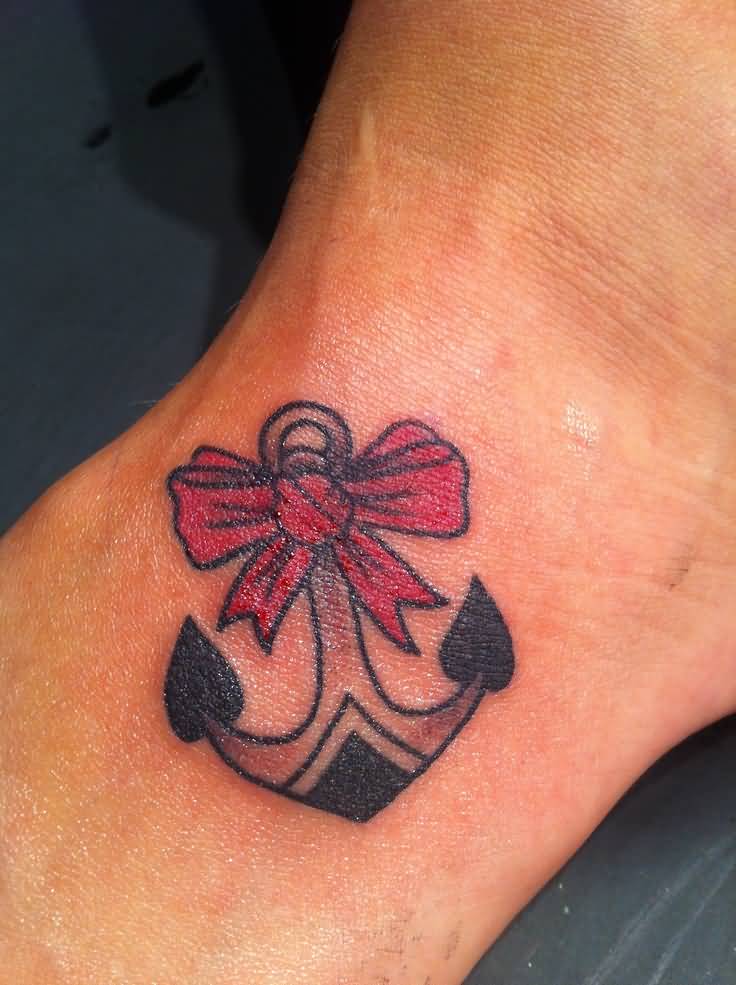 Anchor And Red Bow Tattoo On Bicep