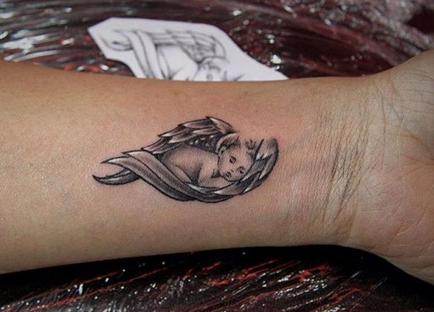 Baby Angel Tattoo On Forearm