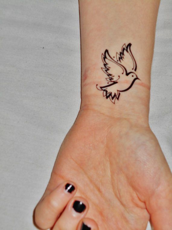 Beautiful Flying Dove Tattoo On Wrist