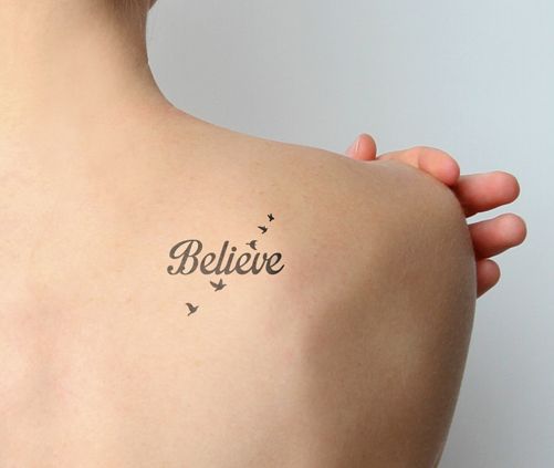 Believe Text And Small Flying Birds Tattoo On Back Shoulder