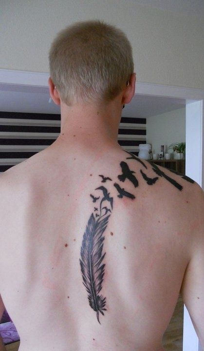 Birds Flying From Feather Tattoo On Man’s back