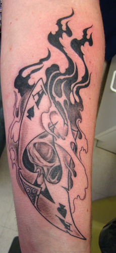 Black And Gray Flaming Ace Of Spade Tattoo On Arm