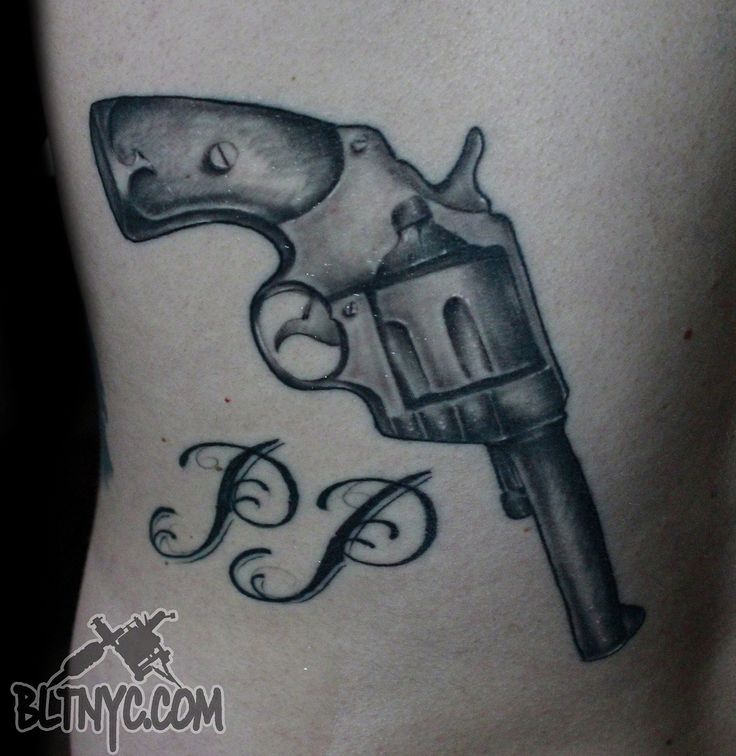 Black And Gray Pistol With PP Text Tattoo On Hip