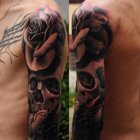Black And Gray Rose And Skull Tattoo On Arm