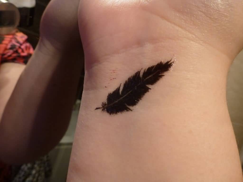Black Feather Tattoo On Wrist