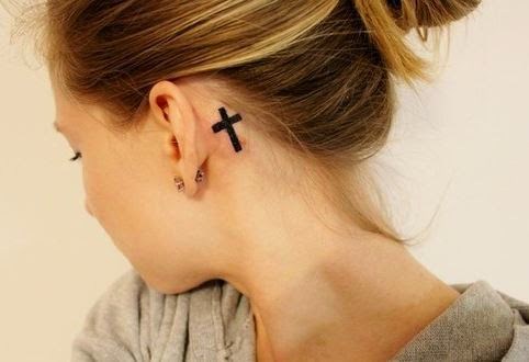 Black Ink Cross Tattoo Behind The Ear