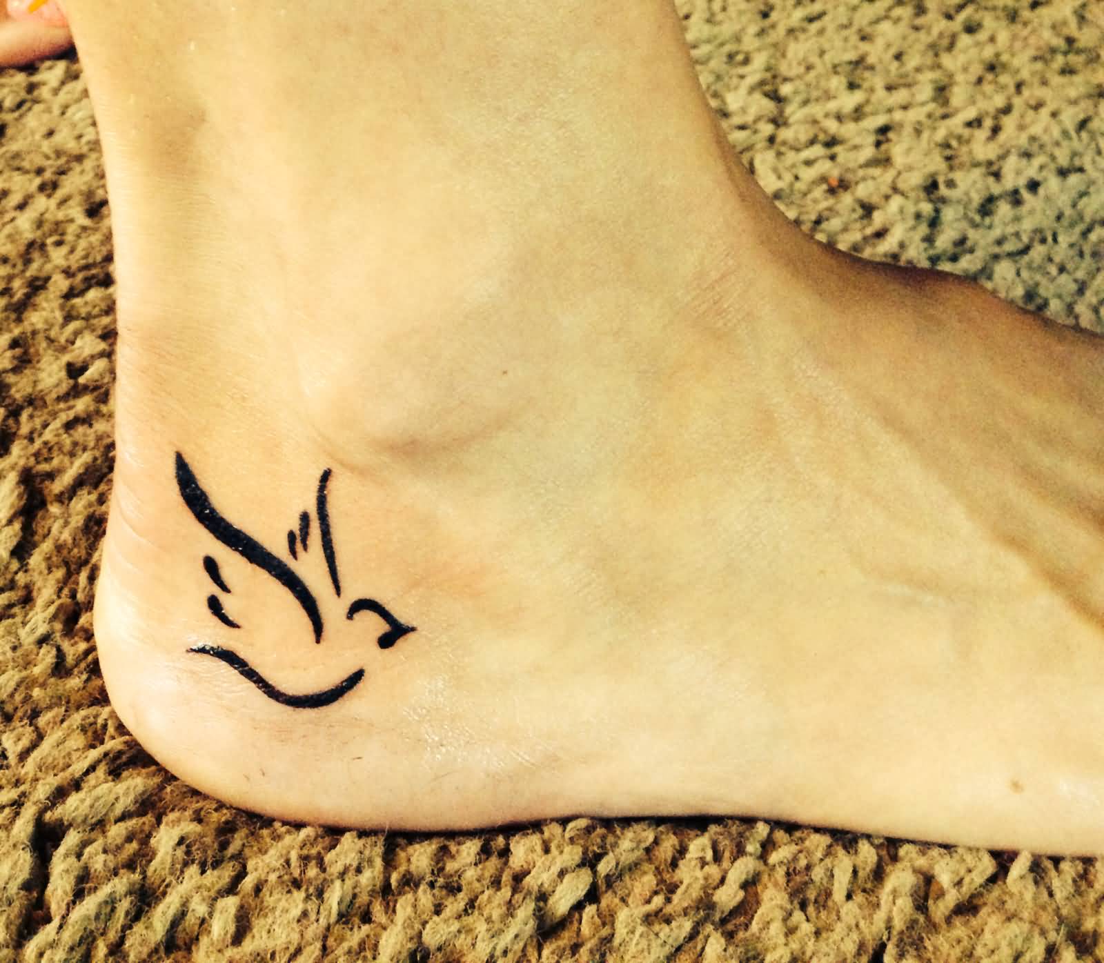 Black Ink Dove Tattoo On Foot
