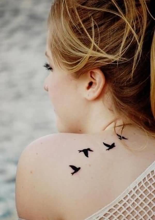 Black Ink Silhouette Birds Tattoo On Girls Back