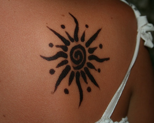 Black Ink Sun Tattoo On Girls Back
