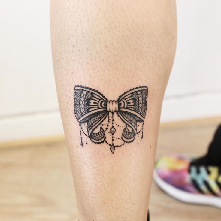 Black Lace Bow Tattoo On Leg