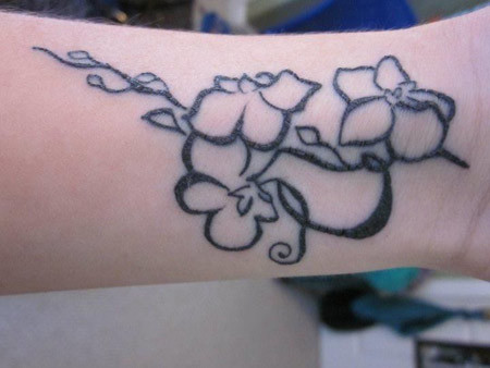 Black Outline Orchid Tattoo On Wrist
