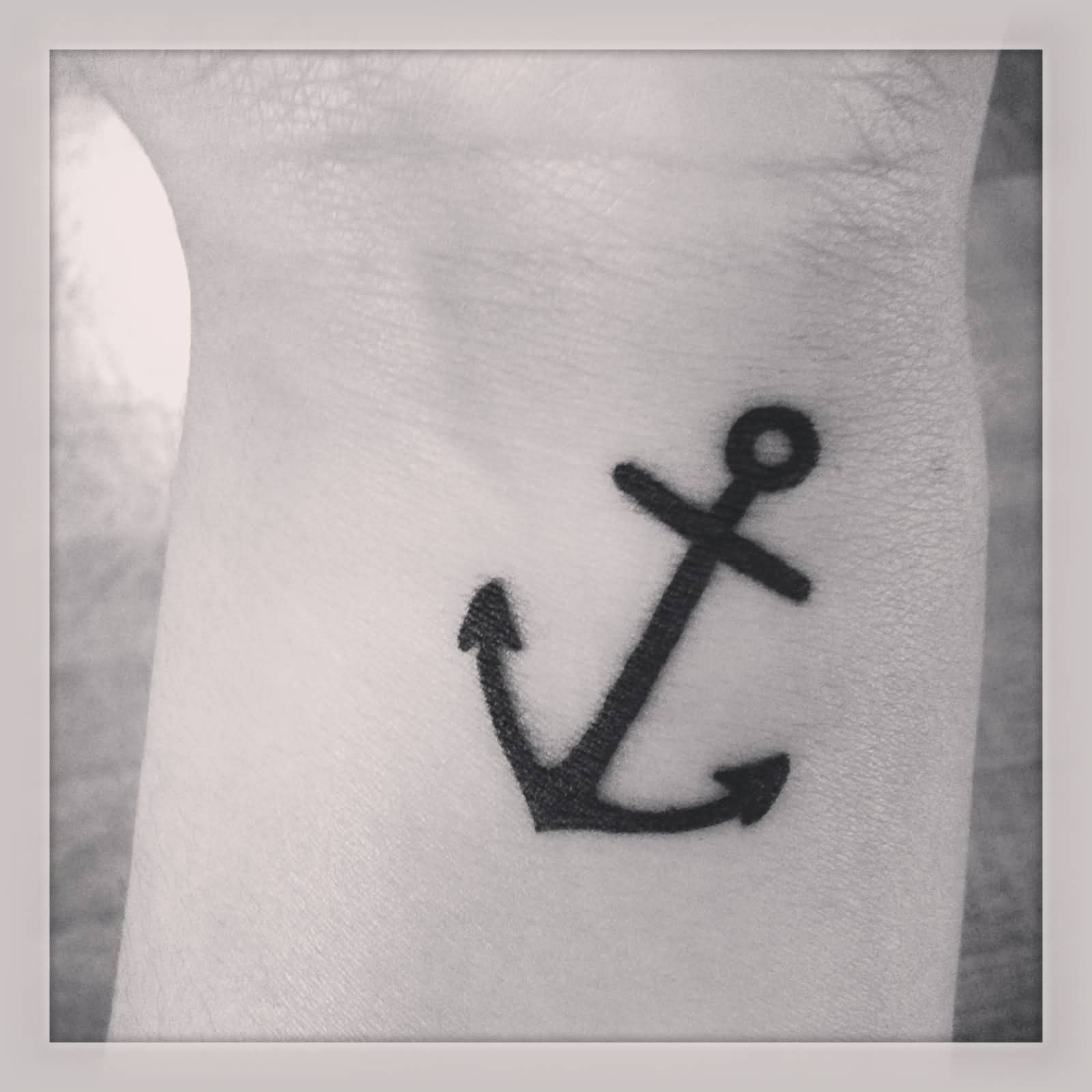 Black Silhouette Tiny Anchor Tattoo On wrist